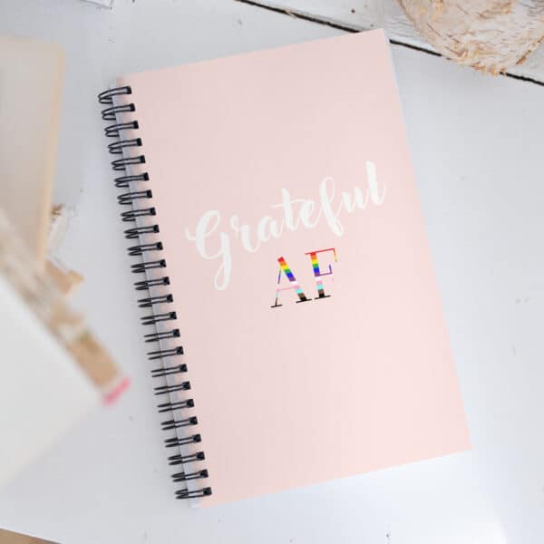 PRIDE "Grateful AF" Notebook pink.  Supports the Trevor Project